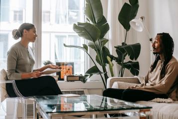 Two people speaking in an office