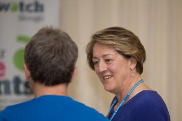 Two women talking about a care home