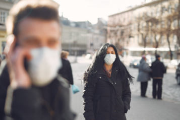 Two people with face masks