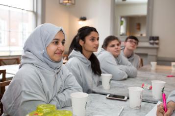 Young people sitting at a desk