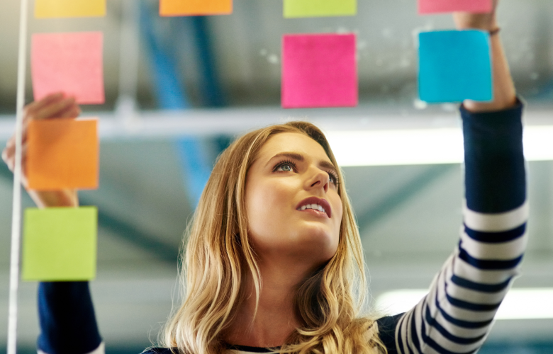 Woman deciding between post it notes