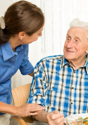 Man looking from seat at female carer