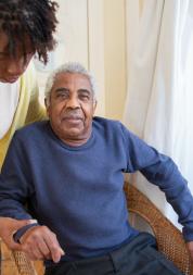 Woman caring for an elderly person